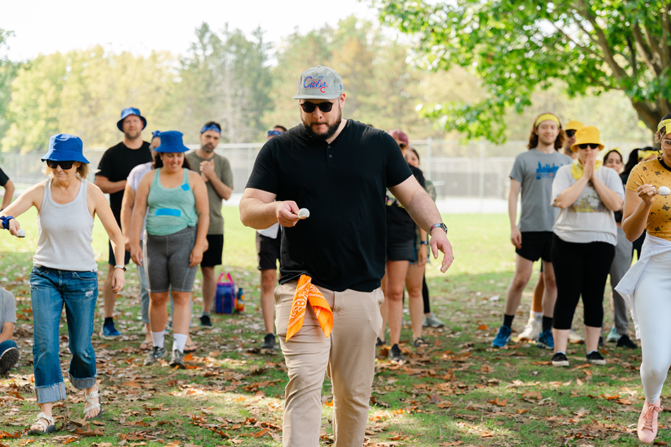 WeekendLongPhoto Photo of a relay race; three people carrying eggs on spoons