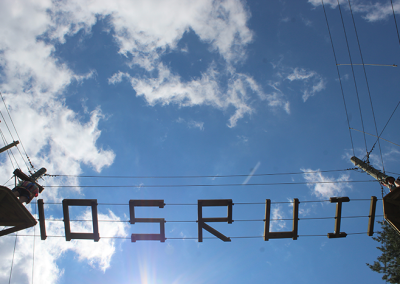 Photo of the ropes course at OSRUI, with the word OSRUI spelled out